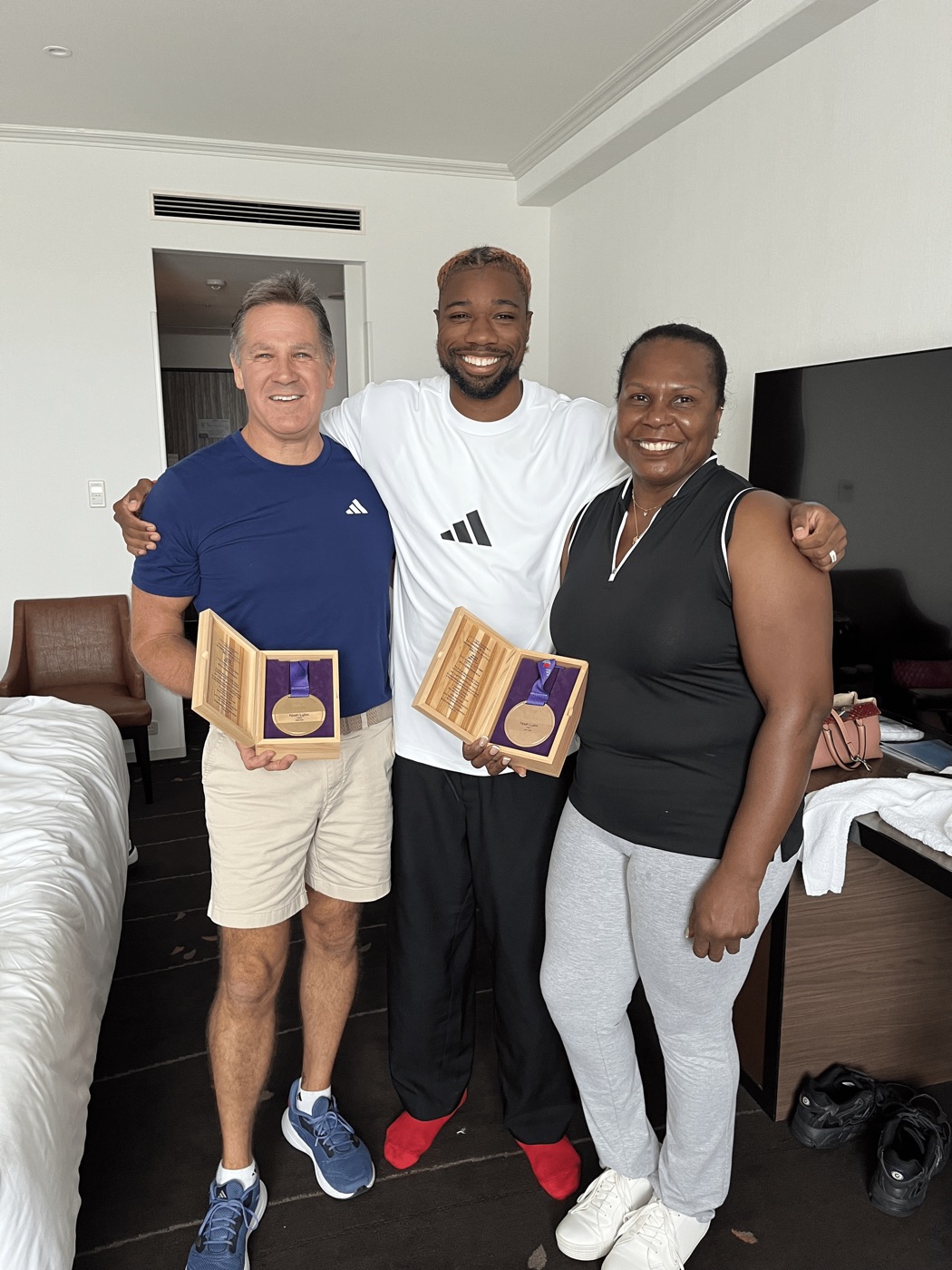 Dr. Obetz with Noah Lyles and massage therapist Mona